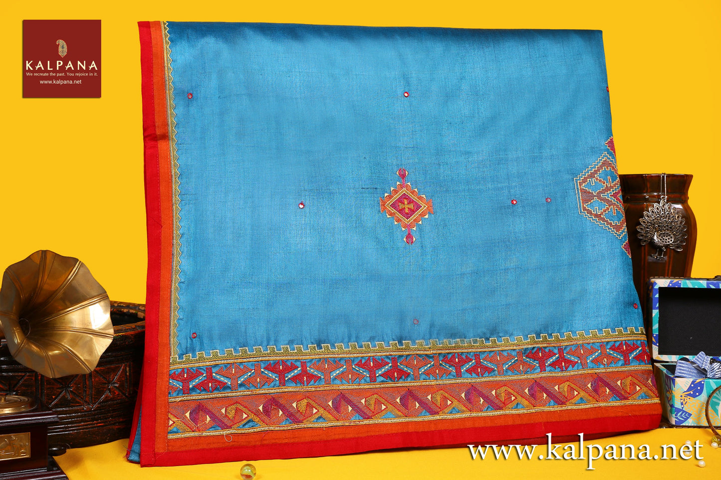 Applique Embroidery Pure Tussar Saree with All Over Motifs and Embroidered Border. The Palla is Embroidered. It comes with Contrast Colored Embroidered Unstitched Blouse with Embroidered Border. Perfect for Semi Formal Wear. Recommended for Autumn & Winter season(s). Dry Clean Only