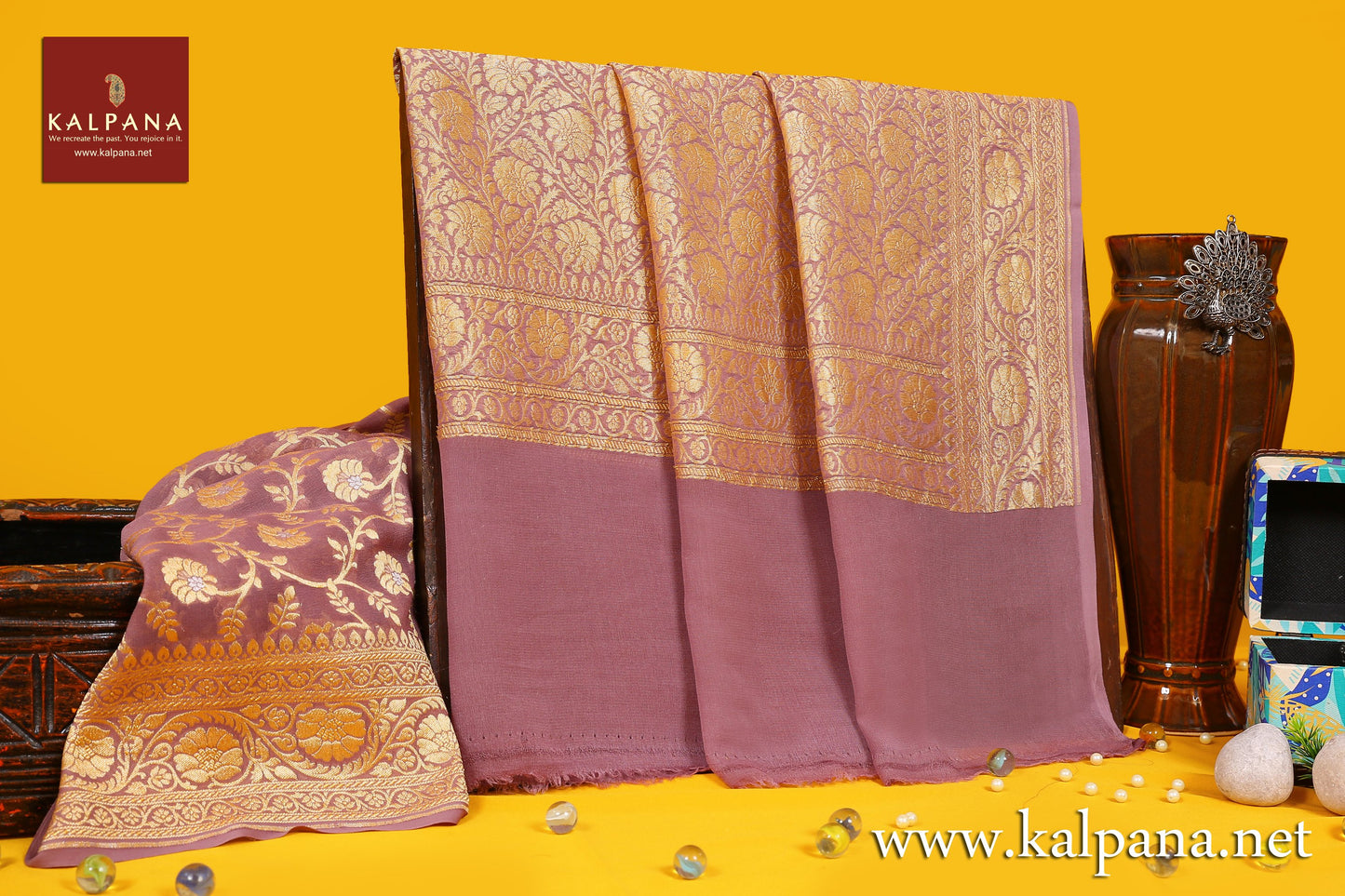 Georgette Handloom Pure Georgette Saree with All Over Jaal and Woven Zari Border. The Palla is  Woven Zari. It comes with Self Colored Plain Unstitched Blouse with Woven Border. Perfect for Formal Wear.  Recommended for all season(s). Dry Clean Only