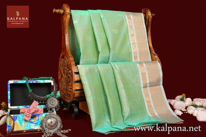 Coimbatore Handloom Pure Cotton Saree with All Over Motifs and Woven Zari Border. The Palla is  Woven Zari. It comes with Contrast Colored Plain Unstitched Blouse with Zari Border. Perfect for Semi Formal Wear.  Recommended for Summer season(s). Dry Clean Only