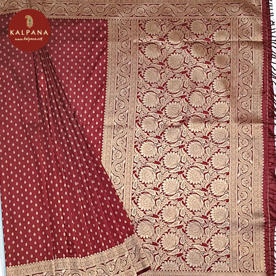 Maroon Red Woven Blended Silk Saree with Zari Border.The Self colored Motifs Unstitched Blouse has Zari Border Perfect for Multi Occasion Wear in Festive season(s). Dry Clean Only.Saree 5.4 mtsBlouse 0.8 mtsCountry Of Origin:IndiaWeight: 500 gms