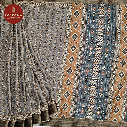 Gray Printed Blended Tussar Silk Saree with Zari Border.The Self colored Printed Unstitched Blouse has Zari Border Perfect for Multi Occasion Wear in Festive season(s). Dry Clean Only.
Saree 5.4 mts
Blouse 0.8 mts
Country Of Origin:India
Weight: 500 gms