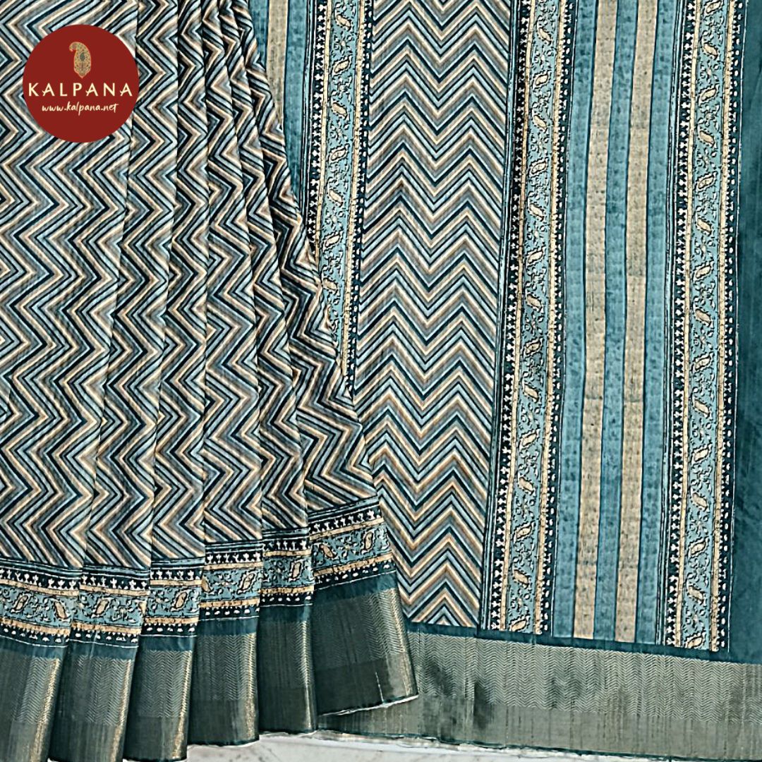 Ocean Blue Printed Blended Tussar Silk Saree with Zari Border.The Self colored Printed Unstitched Blouse has Zari Border Perfect for Multi Occasion Wear in Festive season(s). Dry Clean Only.
Saree 5.4 mts
Blouse 0.8 mts
Country Of Origin:India
Weight: 500 gms