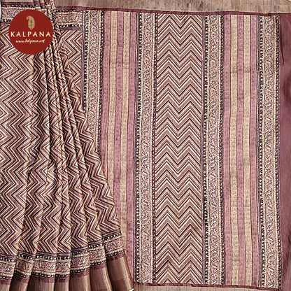 Brown Printed Blended Tussar Silk Saree with Zari Border.The Self colored Printed Unstitched Blouse has Zari Border Perfect for Multi Occasion Wear in Festive season(s). Dry Clean Only.Saree 5.4 mtsBlouse 0.8 mtsCountry Of Origin:IndiaWeight: 500 gms