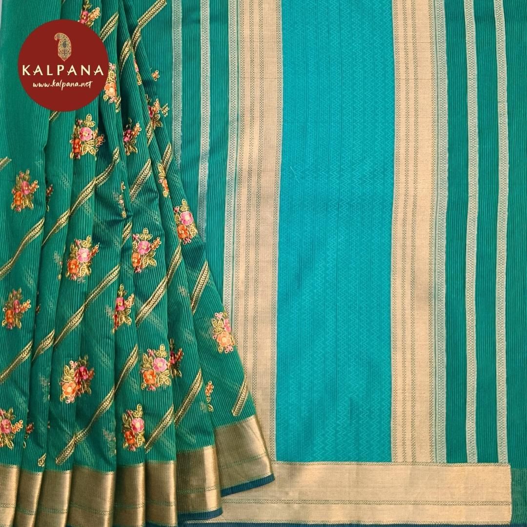 Turquoise Benarasi Embroidery Blended Cotton Saree with Woven Zari Border. The Palla is Woven. The Contrast colored Plain Unstitched Blouse with woven border has Zari Border Perfect for Semi Formal Wear in Summer season(s). Dry Clean Only.
Saree 5.4 mts
Blouse 0.8 mts
Country Of Origin:India
Weight: 500 gms